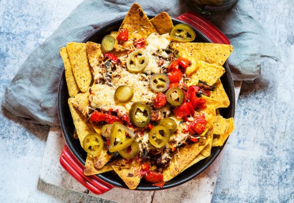 Nachos in a red bowl